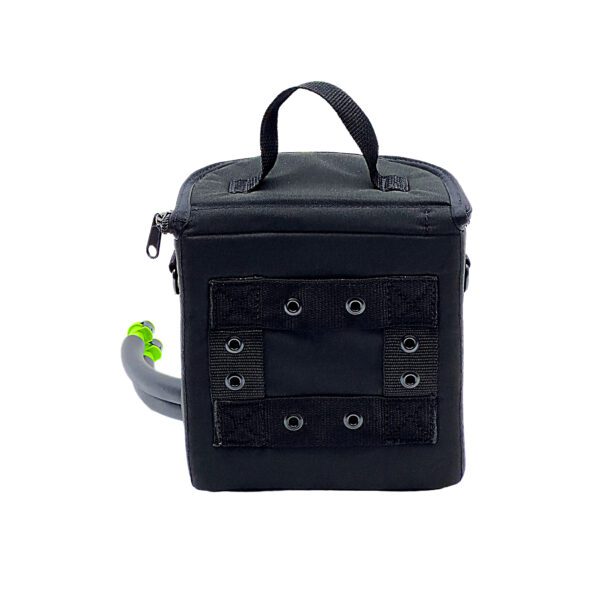 A black bag with grommets and a green handle.