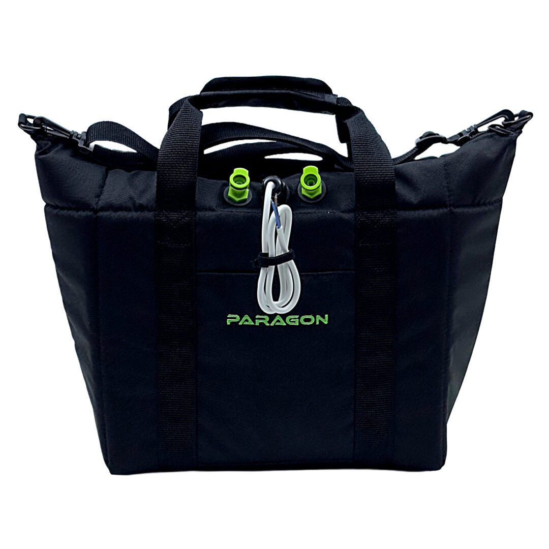 A black bag with a green handle and some white wires