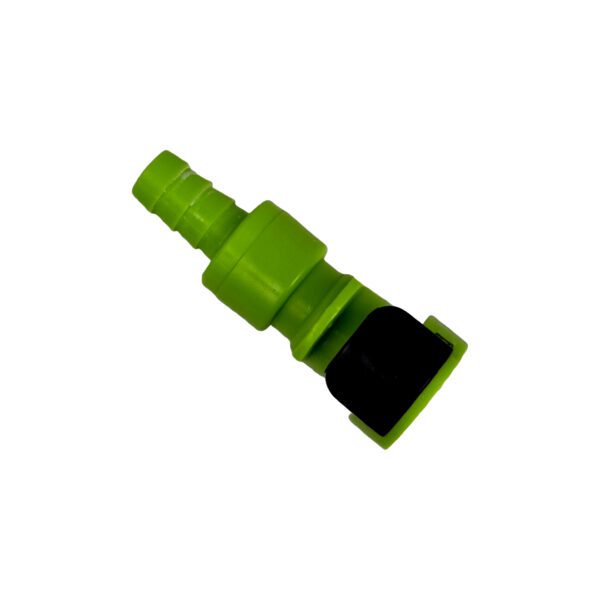 A green plastic piece of equipment with a black object.