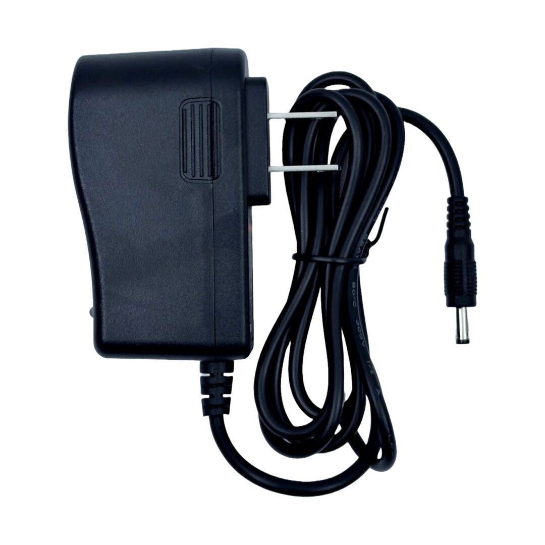 A black power cord is connected to the wall.