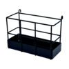 A black metal planter with a shelf on top of it.